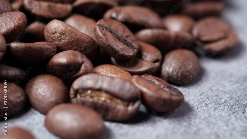 fresh coffee beans on black background close up fresh coffee beans on black background close up