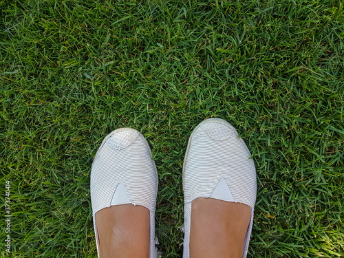 shoes on the green grass outdoor background