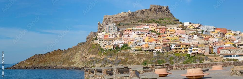 Castel and colorful houses in Castelsardo town, Sardinia, Italy.