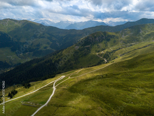 Aerial view on beautiful mountain panorama on the Zwoelferkogel peak in the skiing region of Hinterglemm in the Alps in Austria on a sunny summer day.