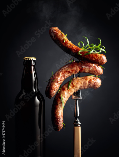 Beer and grilled sausages with rosemary.