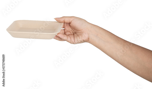 Hand with natural plant fiber disposable on white background