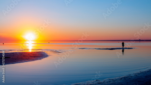 The sunset over the Gulf of Finland The shore of Saint Petersburg