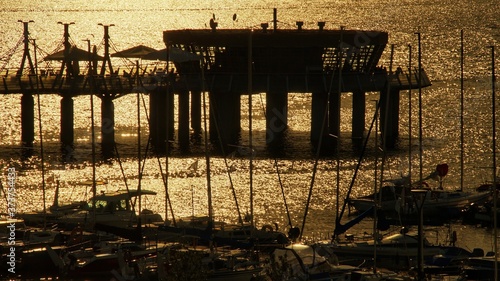 Obraz na plátně View on the pier and marinaon the Vistula river at sunset in Plock, Poland