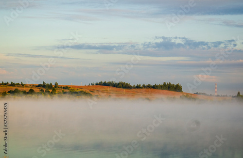 Fototapeta Naklejka Na Ścianę i Meble -  foggy sunrise on the river