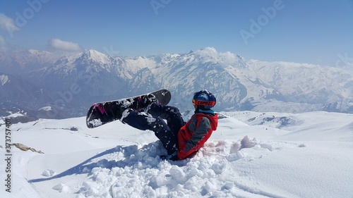 a young skier skiing on the mountain, winter season and snow landscape

