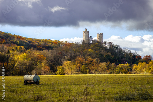 Die Burgen Rudelsburg und Saaleck in der Herbstsonne vor Sturmwolken photo