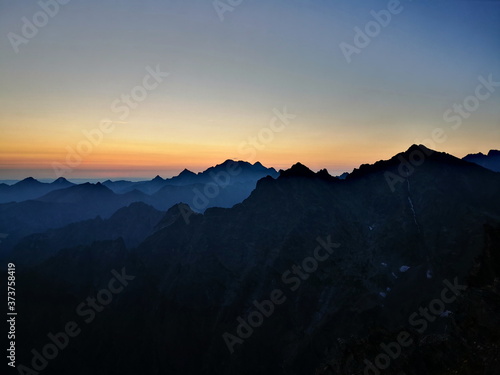 The contours of the mountain peaks at sunrise. Mountain peaks at sunrise. Tatra Mountains Poland.