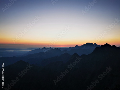 The contours of the mountain peaks at sunrise. Mountain peaks at sunrise. Tatra Mountains Poland.