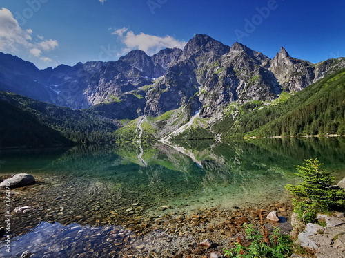 Fototapeta Naklejka Na Ścianę i Meble -  Morskie Oko has a view. Summer in the Tatras, holidays in the mountains. Poland Tatry.