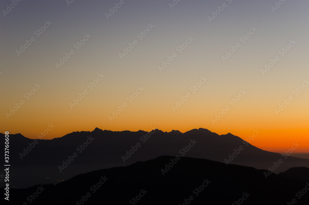 The photo shows the High Tatras mountain range from Low Tatras, Slovakia. The photo shows the High Tatras mountain range from Low Tatras, Slovakia.