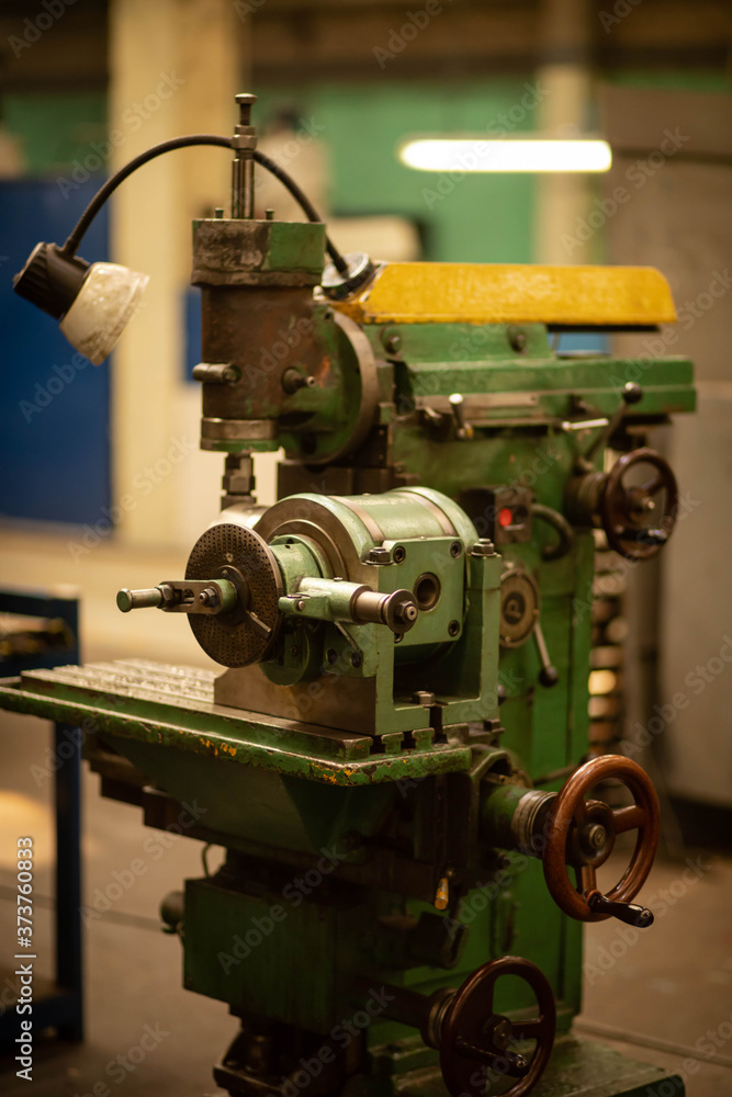 vintage lathe at the factory, turning production