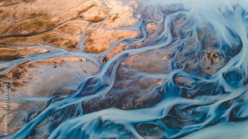 A glacial rivers from above. Aerial photograph of the river streams from Icelandic glaciers. Beautiful art of the Mother nature created in Iceland. Wallpaper background high quality photo photo