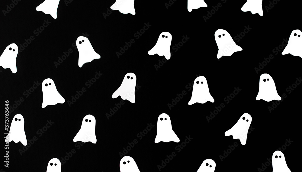 Creative black pattern made of ghosts. Minimal flat lay. Halloween concept. Creative black pattern made of ghosts. Minimal flat lay. Halloween concept.