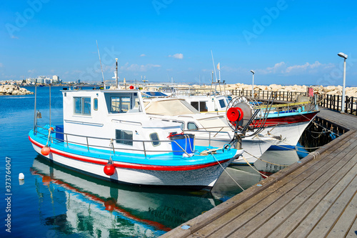 White motorboats marina pier Cyprus
