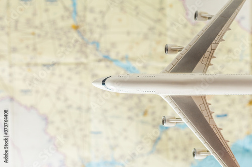 Fotografija Airplane over an aeronautical map with charts