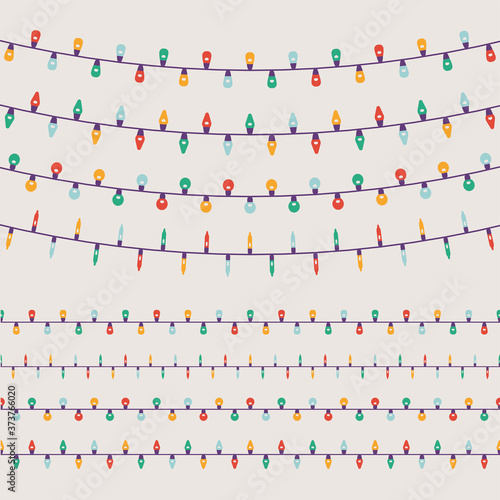 Lovely set of simple vector limited colours flat design Christmas lights garlands with light bulbs of different shapes and forms. Ideal for Xmas winter holiday season graphic and web design
