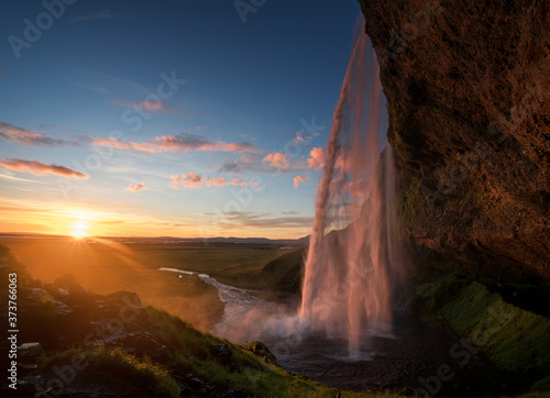 Seljalandsfoss waterfall at sunset  Iceland