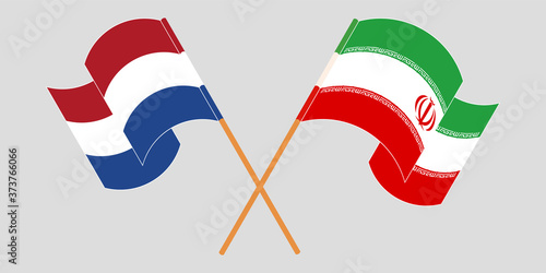 Bild auf Leinwand Crossed and waving flags of Iran and the Netherlands