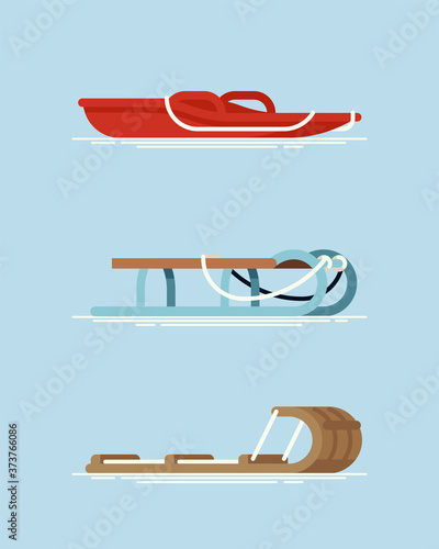 Set of different types of snow sleds. Cool vector flat design on winter season recreational gear. Modern plastic, metal frame and wooden snow sleighs