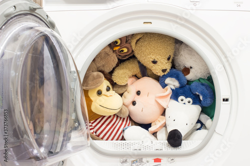 Obraz na plátně Baby toys in the tumble dryer