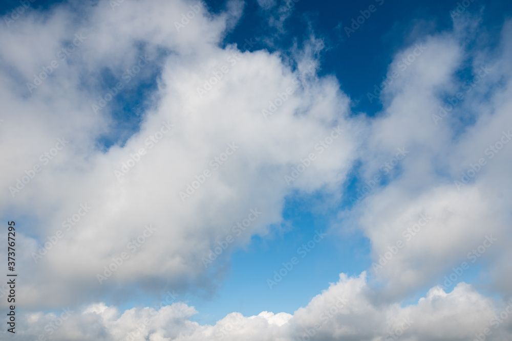 Fototapeta premium Blue sky and white cumulus clouds, natural background