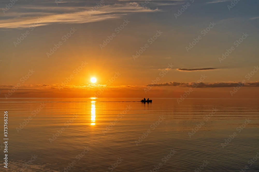 Sunset on the lake in summer, Pskov region	