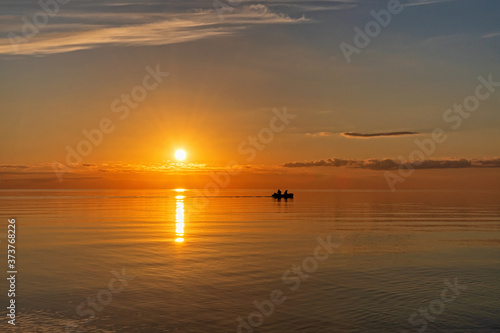 Sunset on the lake in summer, Pskov region 