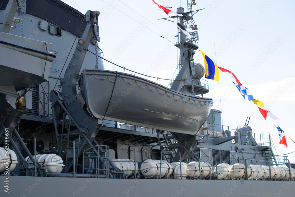 rescue boat in transport position on the deck of a warship.