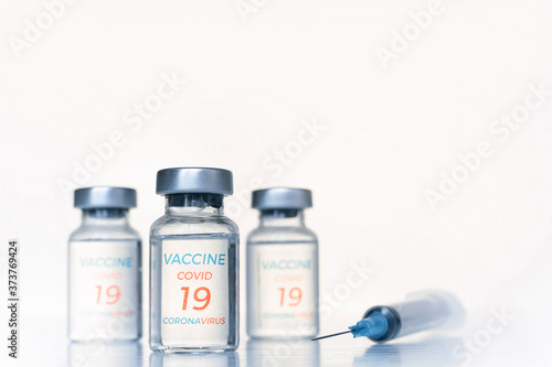 Transparent vials, syringe with new vaccine for covid-19 coronavirus, flu, infectious diseases. Injection after clinical trials for vaccination of human, child, adult, senior. Medicine, drug concept