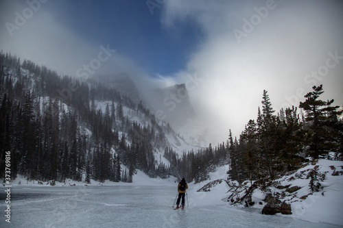 mountains snowy near forzen lake photo