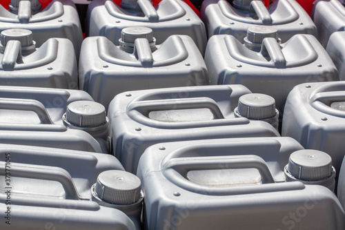 plastic canisters of grey color in the warehouse
