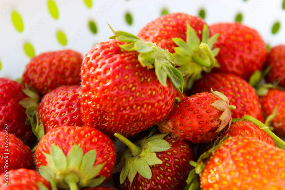 Background from freshly harvested strawberries, directly above. Summer photo with beautiful and juicy strawberries. Fresh organic berries macro. Red ripe. Close up, isolated. Background from freshly harvested strawberries, directly above. Summer photo with beautiful and juicy strawberries. Fresh organic berries macro. Red ripe. Close up, isolated.
