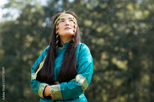 Photos Mongolian woman wearing typical Mongolian cyan dress.