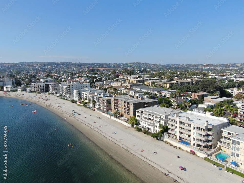 Aerial view of Mission Bay and beaches in San Diego, California. USA. Community built on a sandbar with villas and recreational Mission Bay Park. Californian beach-lifestyle. Aerial view of Mission Bay and beaches in San Diego, California. USA. Community built on a sandbar with villas and recreational Mission Bay Park. Californian beach-lifestyle.
