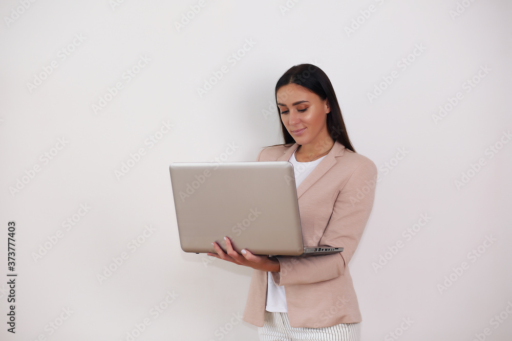 Young hispanic business woman. holding laptop, white background Young hispanic business woman. holding laptop, white background
