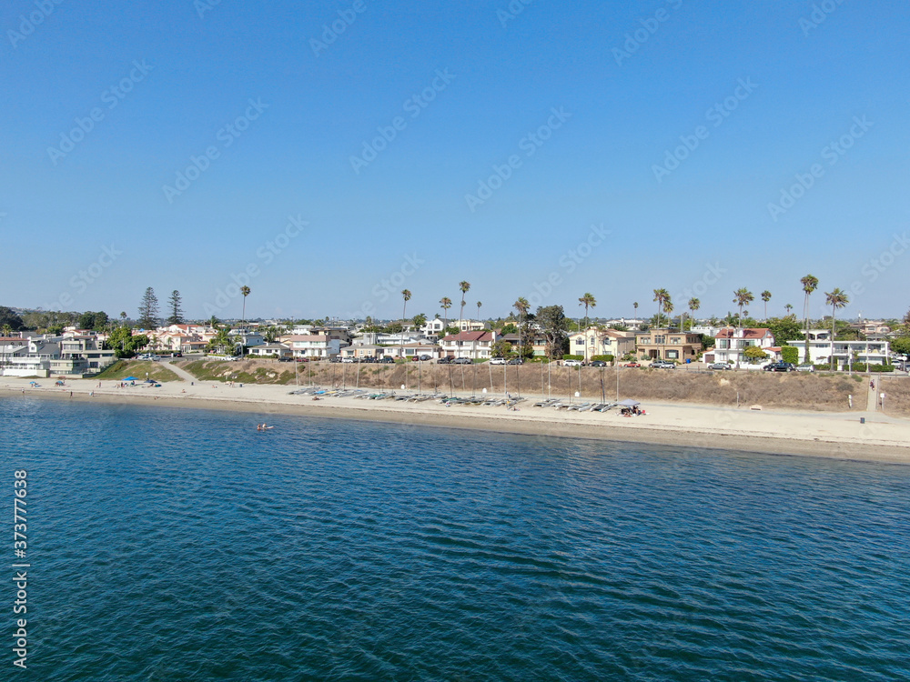Aerial view of Mission Bay and beaches in San Diego, California. USA. Community built on a sandbar with villas and recreational Mission Bay Park. Californian beach-lifestyle. Aerial view of Mission Bay and beaches in San Diego, California. USA. Community built on a sandbar with villas and recreational Mission Bay Park. Californian beach-lifestyle.