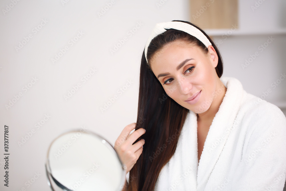 Studio portrait of a beautiful young woman with brown hair. Pretty model girl with perfectly fresh clean skin. Studio portrait of a beautiful young woman with brown hair. Pretty model girl with perfectly fresh clean skin.