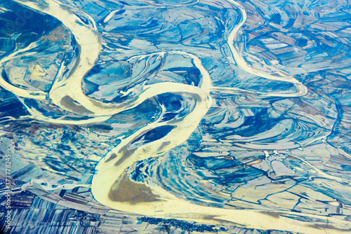 Aerial view of land and Songhua River covered by ice, northeast China photo
