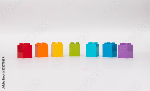 Plastic building blocks isolated on white background.
Blocks of colors of the rainbow.
Early learning. Educational toys
