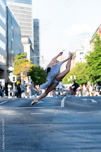 Beautiful ballet dancer ballerina outdoors,Ballerina dancing on the street in Dusseldorf City .