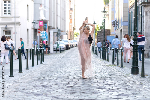 Beautiful ballet dancer ballerina outdoors,Ballerina dancing on the street in Dusseldorf City .