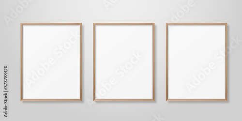Vector 3d Realistic Three A4 Brown Wooden Simple Modern Frame on a White Wall Background. It can be used for presentations. Design Template for Mockup, Front View