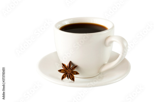 Cup of aromatic black coffee in a white cup isolated on a white background with star anise.