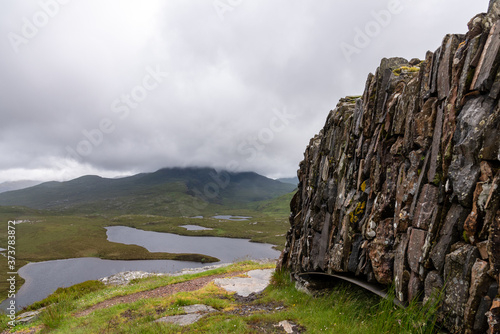 Beautiful scenery of a loch in Knockan Crag National Nature Reserve in Northwest Highlands, Scotland photo