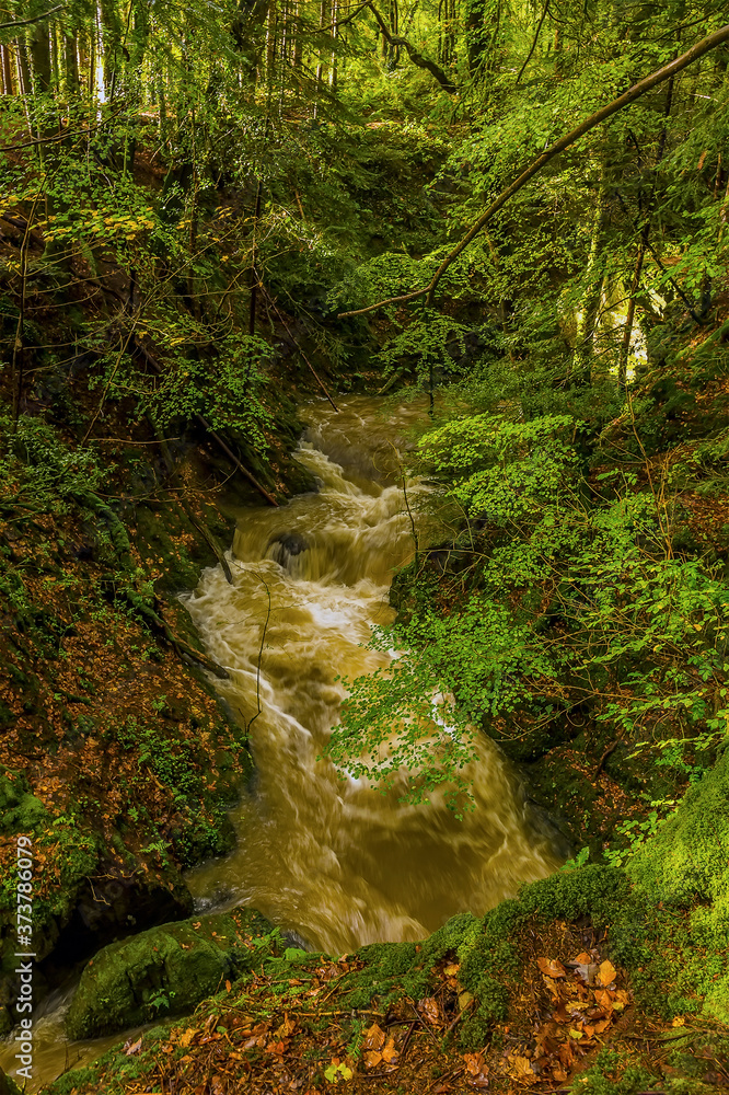 A long exposure view over the stream feeding the waterfalls at Ffynone, Wales after heavy rainfall A long exposure view over the stream feeding the waterfalls at Ffynone, Wales after heavy rainfall