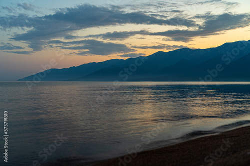 Scenic baikal lake in summer, pastel blue dawn