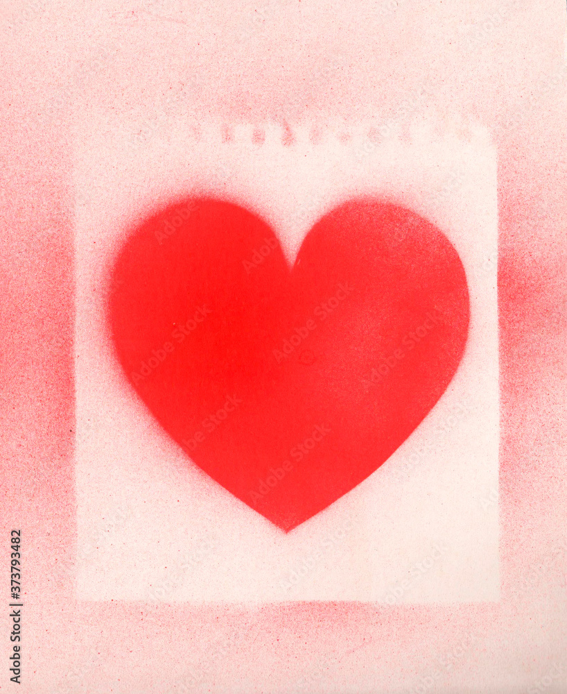 Spray paint heart sign, shape heart graffiti on white paper background with perforation traces