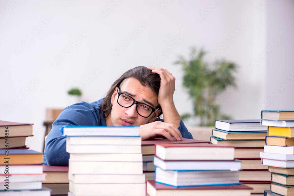 Young male student preparing for exams at home Young male student preparing for exams at home