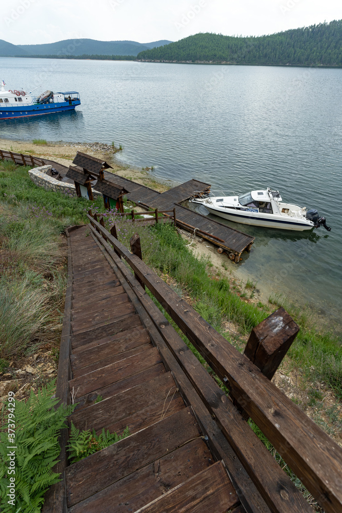 Russia, Irkutsk region, Baikal lake, July 2020: wooden stairs, leading to a russian northern national park